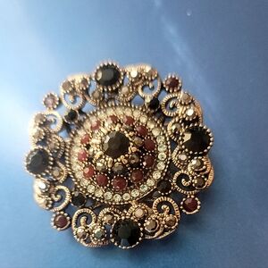 Vintage-Inspired Gold Brooch with Black and Burgundy Gem Accents
